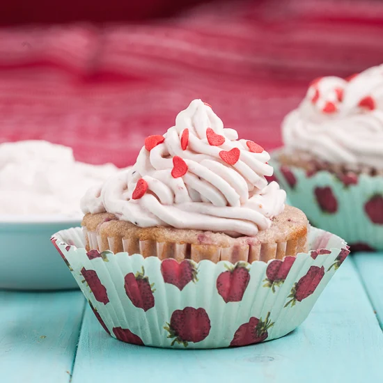 Valentine's day cupcakes, strawberry and whipped cream. 