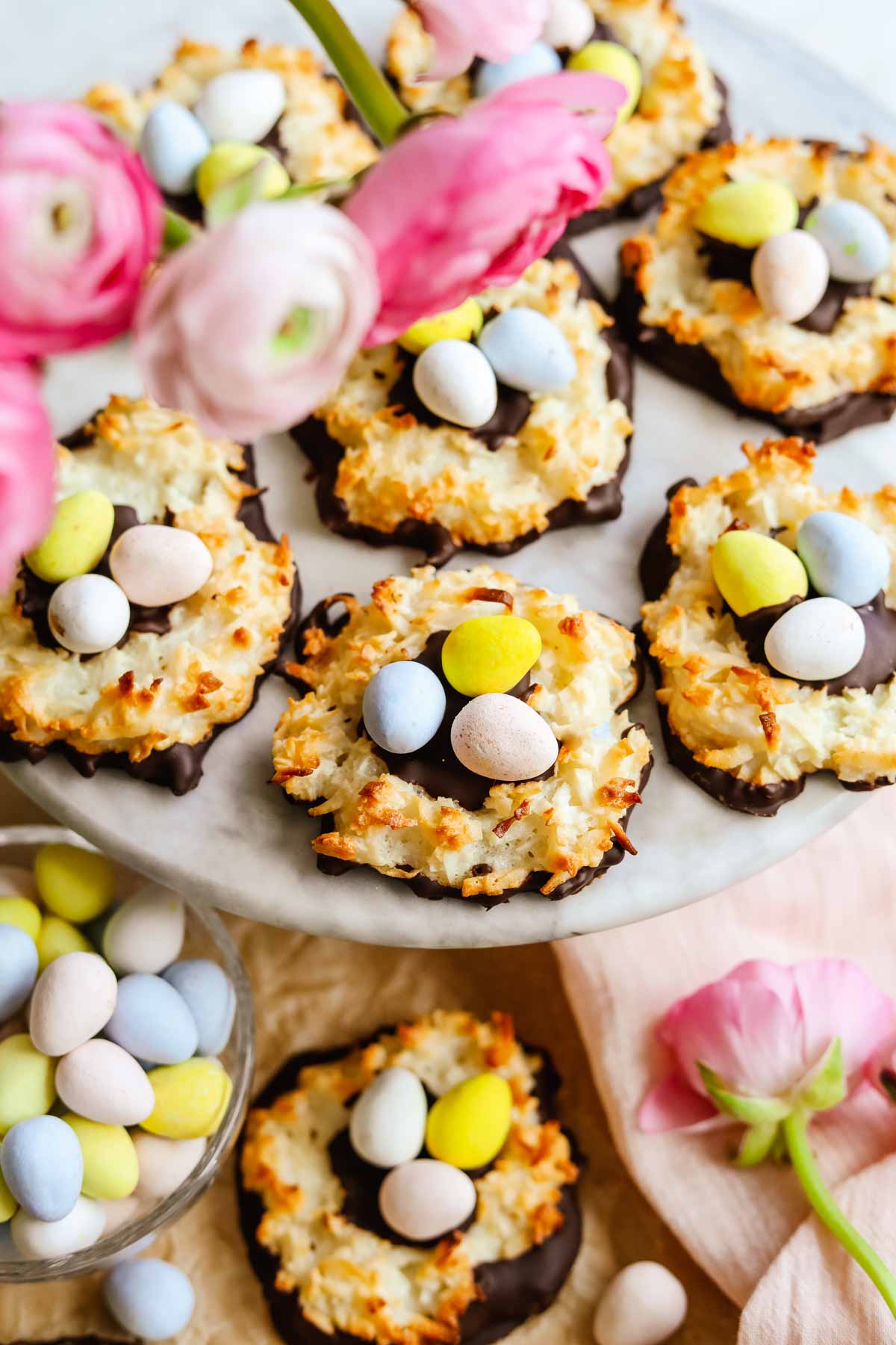 Celebrate the essence of spring with the Spring Macaroon Nests from The Heirloom Pantry. This delightful Easter dessert is a symphony of coconut, almond, and pastel-colored delights. These adorable nests, made with macaroon shells, are not only visually charming but also a treat for the taste buds. The crisp exterior of the macaroon gives way to a chewy and coconut-infused interior, creating a delightful texture. Topped with vibrant pastel candies, they resemble charming nests ready to be filled with Easter joy. Whether you're planning a festive gathering or simply want to add a touch of whimsy to your dessert table, these Spring Macaroon Nests are a delightful choice. Explore the details of this charming recipe on The Heirloom Pantry website and infuse your Easter celebration with sweetness and style.