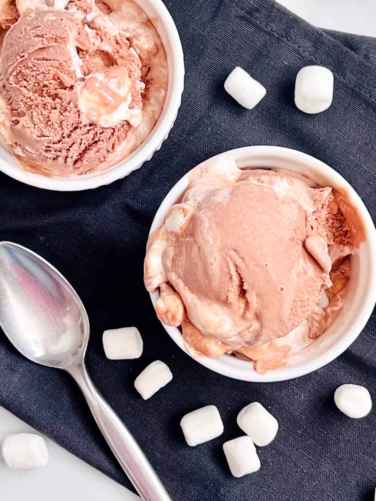 Chocolate-Marshmallow-Ice-Cream-Overhead-two-bowls-on-a-black-cloth-napkin-with-spoon-and-mini-marshmallows